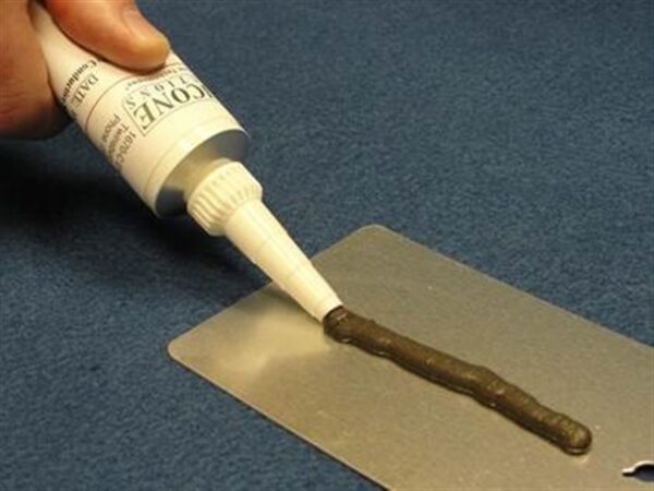 Applying adhesive from a tube