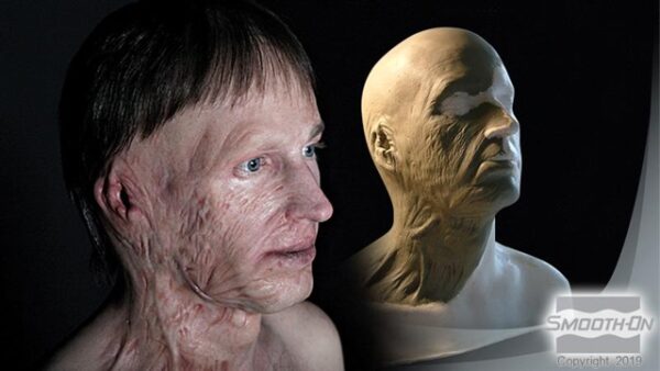 Realistic sculpture next to human figure.