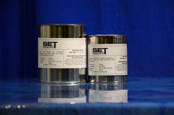 Two metal cans with labels